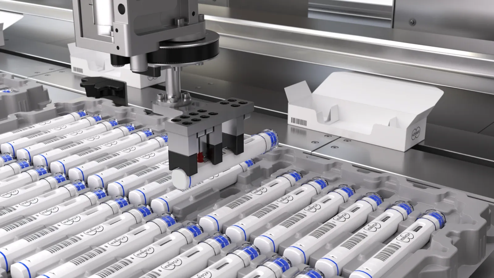 Picture of a parenteral packaging machine where autoinjectors being placed inside a box.
注射剂包装设备中正在将自动注射器装入盒内的图片